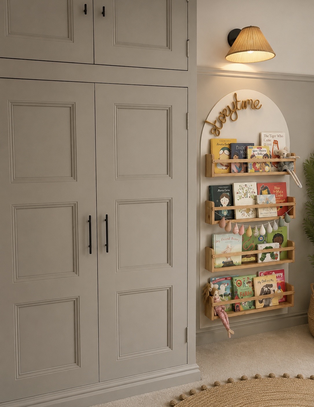 Fitted wardrobe beside an arched nook with children's bookshelves